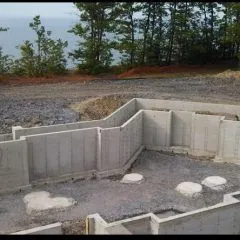 Finished poured concrete foundation walls with the forms removed